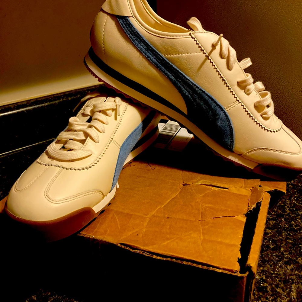Sz 13 white with alight blue Nike sign brown bottom